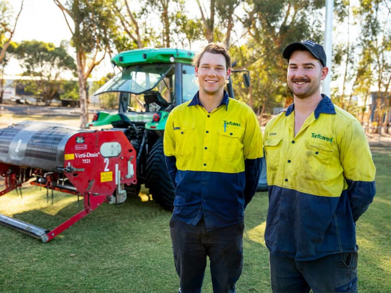 Turfcare Team Smiling by Machine